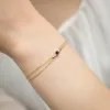 Złota bransoletka z czarnym diamentem 0,12ct i brylantami  0,029ct B0003
