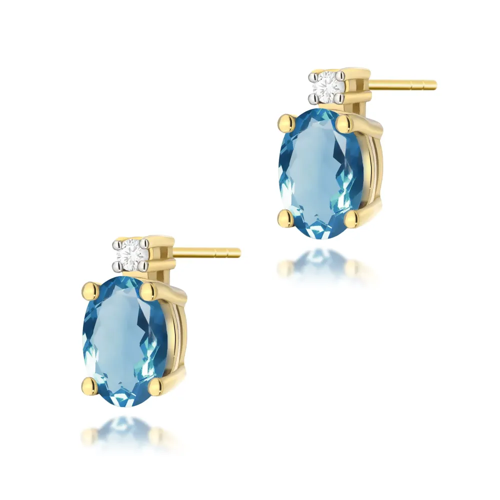 Złote kolczyki z topazem london blue 1,00ct i brylantami 0,029ct K0001