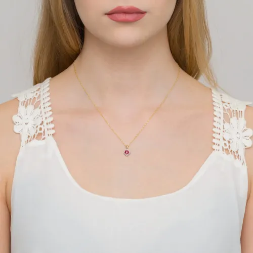 Złota zawieszka z różowym topazem 0,60ct i brylantami 0,06ct Z0571