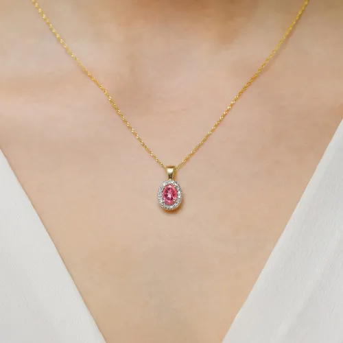 Złota zawieszka z różowym topazem 0,50ct i brylantami 0,08ct Z0574
