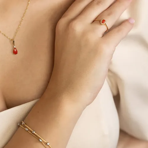 Złoty pierścionek z koralem 0,20ct i brylantami 0,08ct W0569